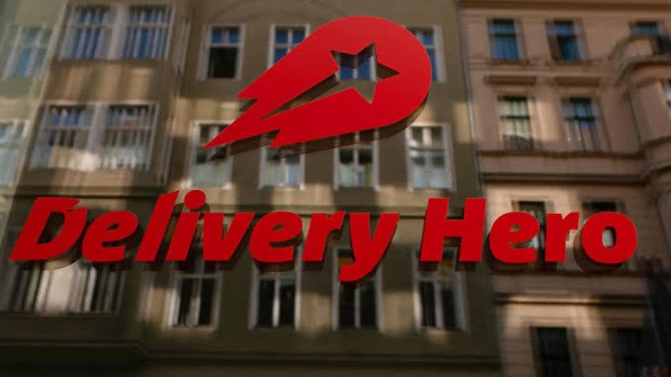 Delivery Hero logosu, Uber satın alımı, yemek teslimat sektörü.
