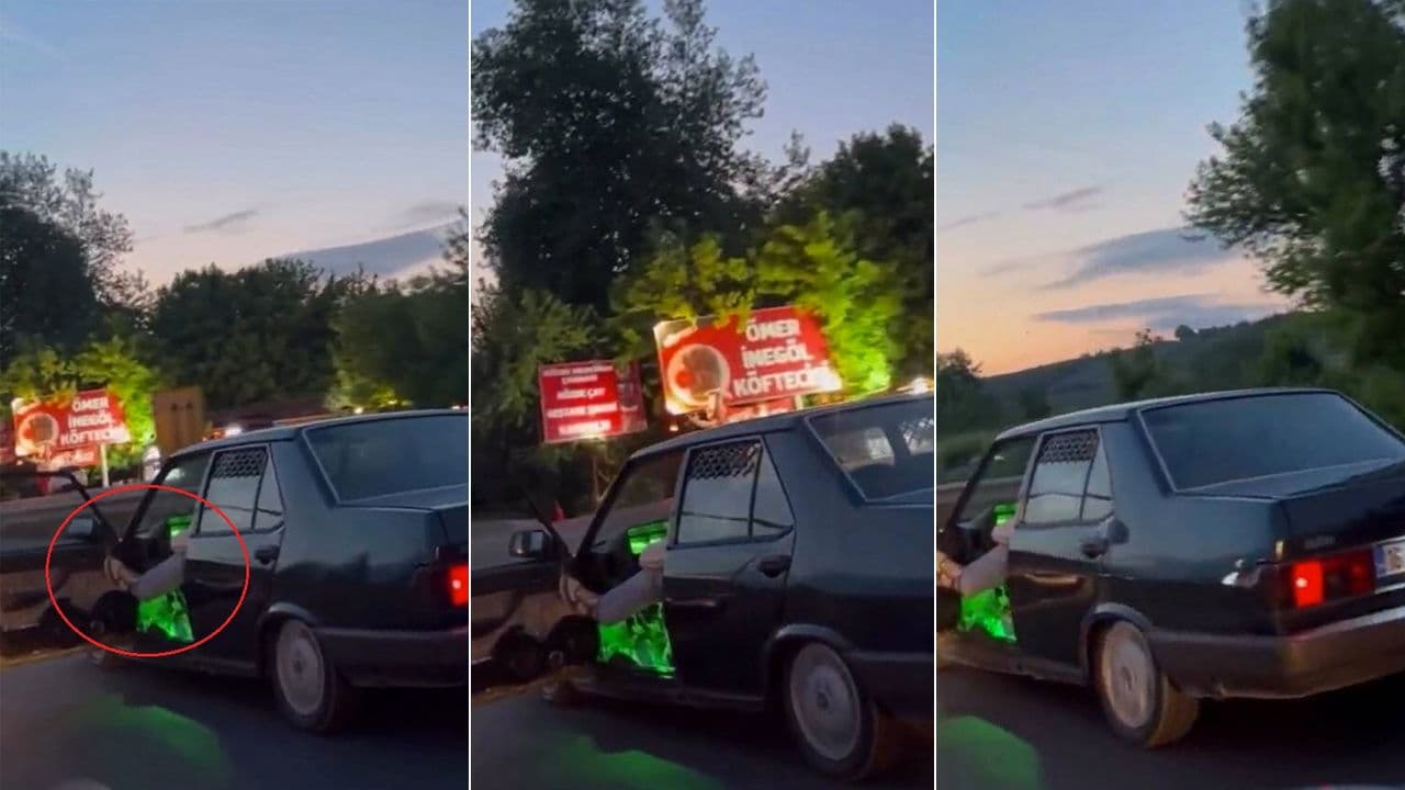 Bursa İnegöl'de kapısı açık ve ayağı dışarıda seyreden otomobil.