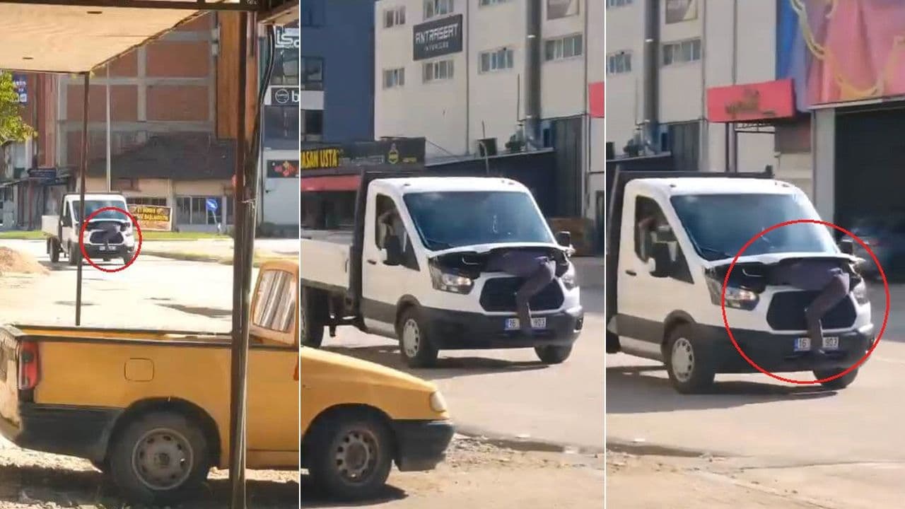 Bursa'da hareket halindeki kamyonetin kaputuna çıkarak arıza tespiti yapan tamirci.